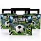 Three soccer-themed party favor boxes with black handles, featuring a soccer ball, goal net, grass, and stadium lights on the front, with the text 'ELIJAH'S 7TH BIRTHDAY' and 'GOAL TIME'.